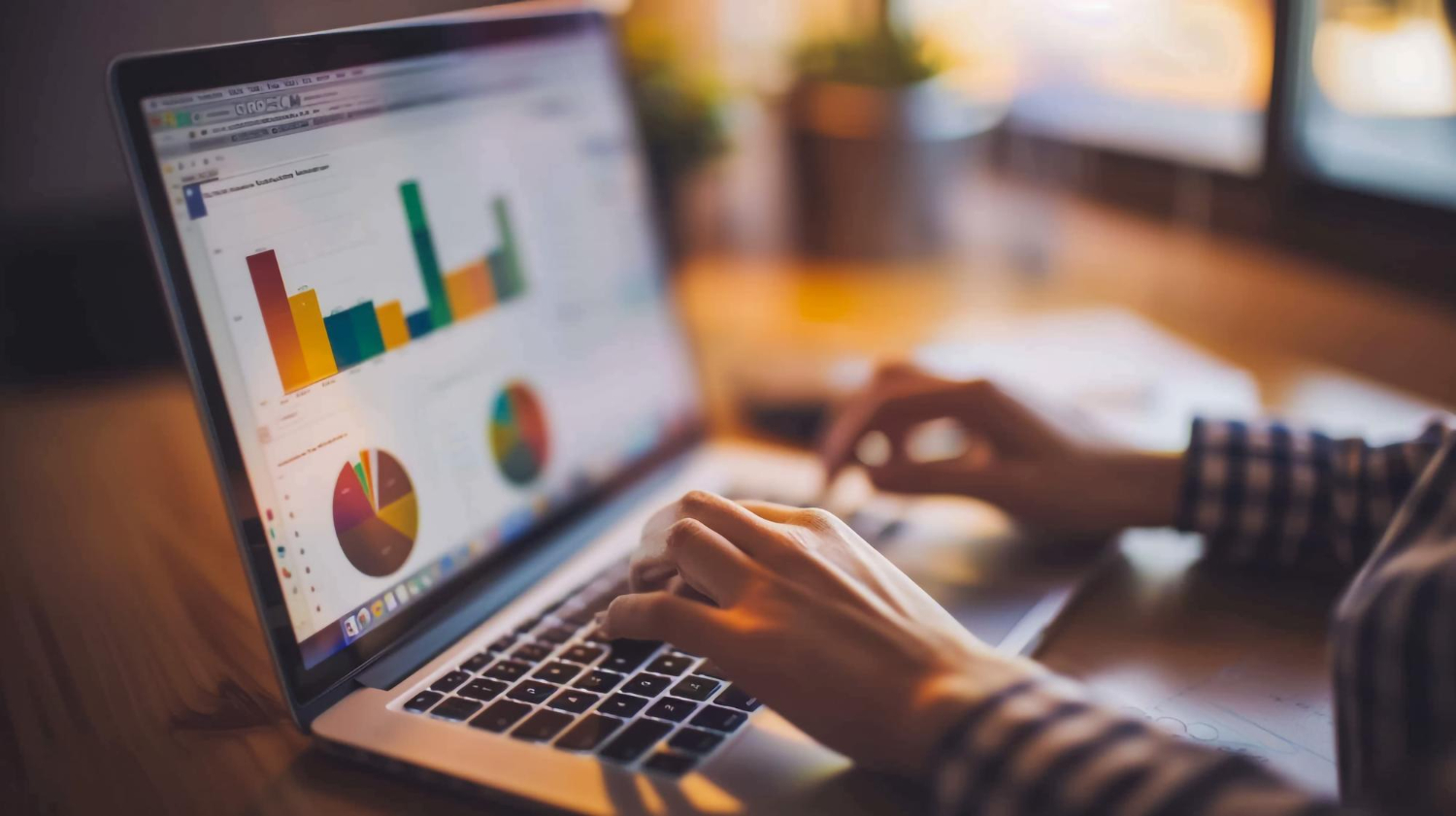 Bar chart analytics and spreadsheet showing bounce rate metrics on laptop